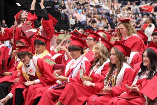 McLoud High School 2026 graduate Leroy Thomas surprised his fellow grads by throwing a stack of dollar bills to them before receiving his diploma on May 23.