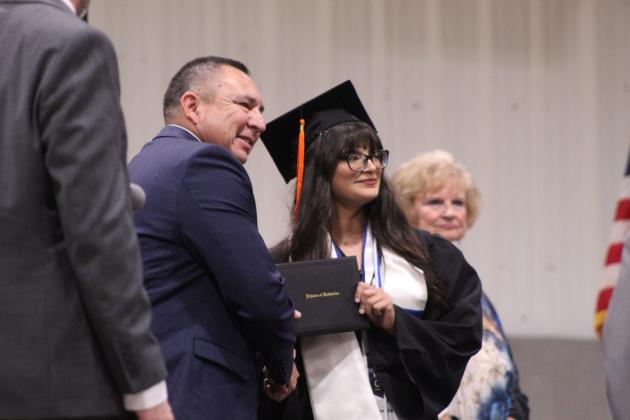 Nataleigh Lamas receives her diploma from Superintendent Brad Hawkins during Maud High School's Graduation on May 22 at the Ed Harman Gymnasium. Maud graduated 20 seniors.