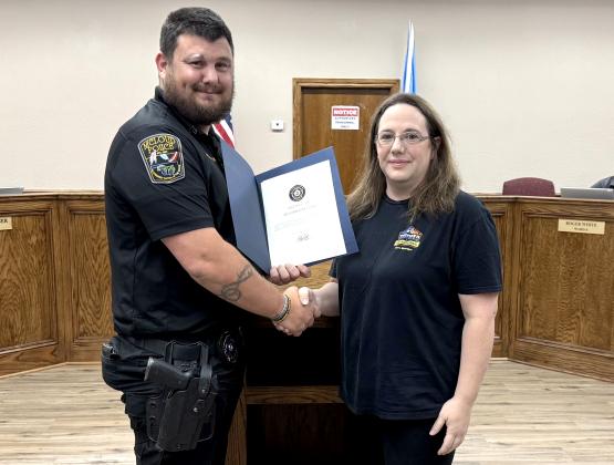FOP President Chris Bacon gave an award  to Emily Santoro for her eforts to assist the police department with the Blackberry Festival and other city events. Julie Talton, Countywide &amp; Sun