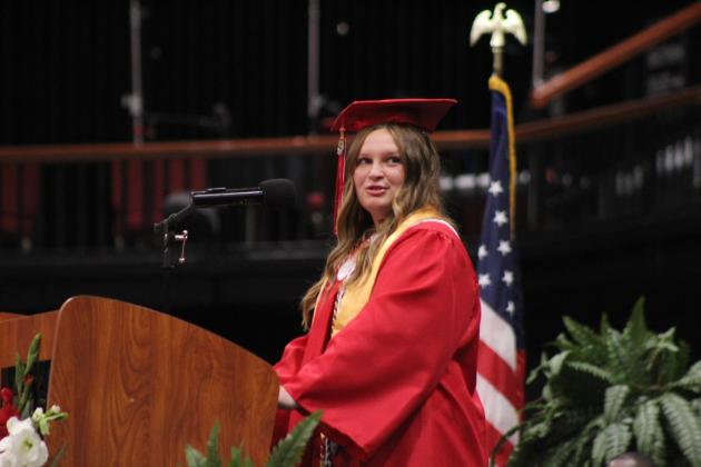 McLoud High School Valedictorian Dani Easley thanks her teachers in the audience during graduation on May 23.