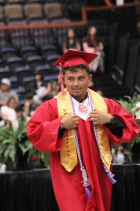 McLoud High School Valedictorian Kaleb Fox prepares to deliver his speech at graduation on May 23 at FireLake Arena.