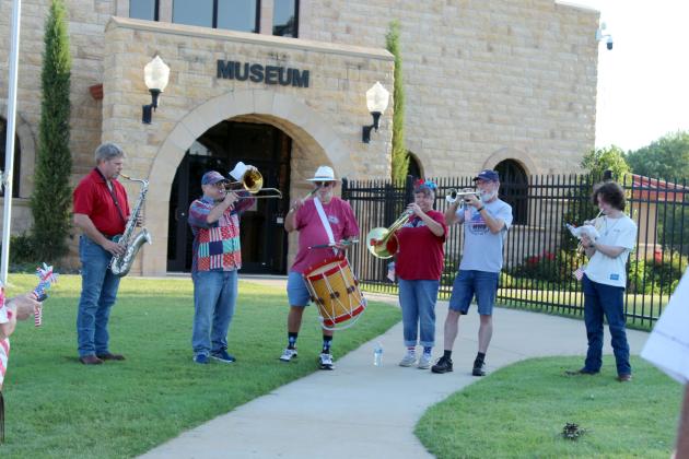 The Oklahoma Jazz Preserve performs the "Star Spangled Banner" in front of the Pottawatomie County Museum (Paul and Ann Milburn Center) before leading the Shawnee Independence Day Parade on July 4. Shown, from left, are Spencer Davis on saxophone, Toppie Lincicome on trombone, Al Hullum on drum, Ashley Caldwell on French horn, Brian Durham on trumpet and Brantley Longest on trumpet. An incoming Shawnee High School freshman, Longest also played "Taps" and led the flag salute during the presentation later.