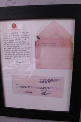 A letter from England's King George thanking US soldiers for fighting alongside their troops in WWI and dated April 1918 is among the recently restored items on display at Shawnee's American Legion Post 16.