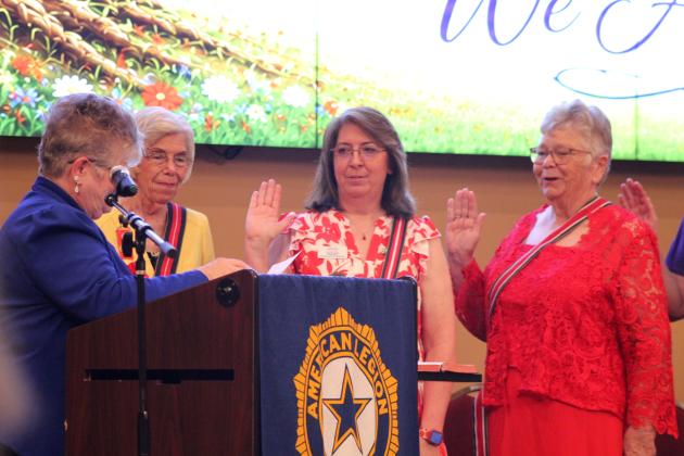 Vickie Thrower-Mills, the Southern Division National Vice President of the American Legion Auxiliary, far left, swears in Oklahoma State Auxiliary Immediate Past President Kim McInnis and 2026 President Donna Snodgrass during the American Legion Auxiilary Department Summer Convention, held at the Grand Casino Hotel and Resort on July 12.