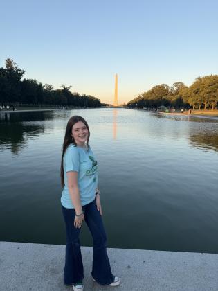 North Rock Creek senior Victoria Nelms stands in front of the Reflecting Pool and the Washington Monument in Washington, DC, during the 4-H Citizenship Washington Focus leadership program, July 5-11.