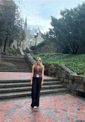 Ally Fitchner poses in front of the Georgetown University School of Medicine.