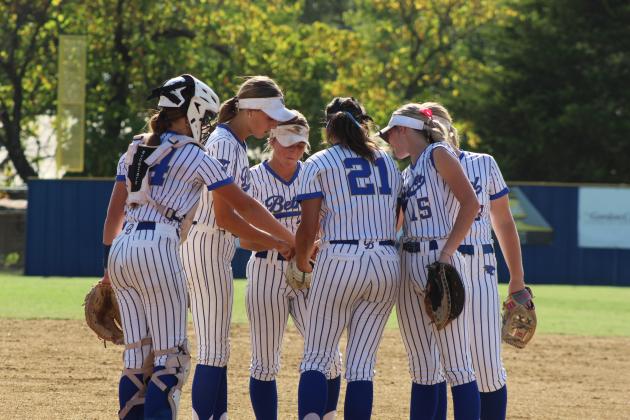 The Bethel Lady Wildcats infield players huddle before the second inning of the Aug. 17 home game against Prague. Photos by Natasha Dunagan, Countywide &amp; Sun