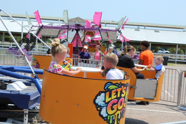 Despite the heat, children and teens enjoyed the carnival rides and inflatables during the FireLake Fireflight Balloon Festival on Aug. 7 and 8. Armbands were sold, but there was also a free splash pad and petting zoo.