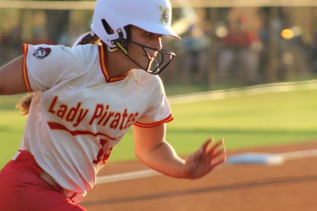 Dale junior Taelyr Norman runs to first after hitting a single during the Aug. 18 home game against Tecumseh. The Lady Pirates won 10-0, and are 9-0 for the season so far.
