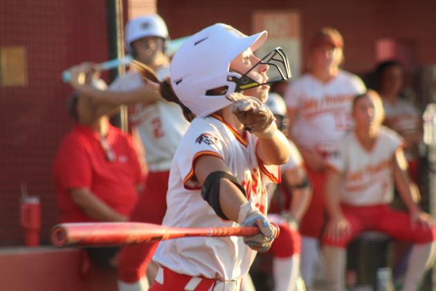 Dale senior Jayse Smith hits a single and watches it soar during the Aug. 18 home game against Tecumseh. The Lady Pirates won 10-0, and are 9-0 for the season so far.