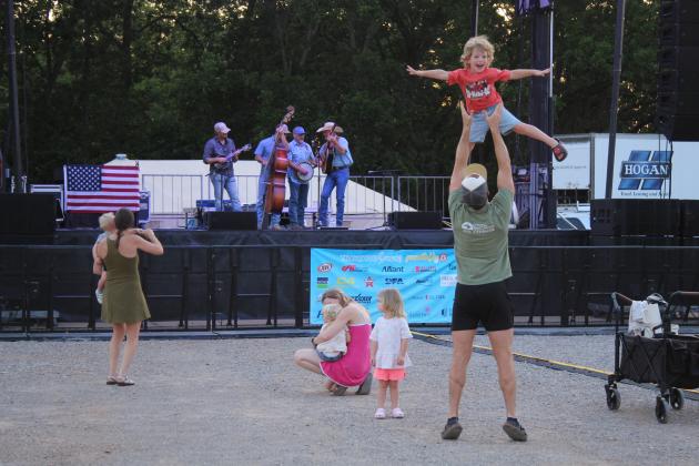 The Bullard family has fun while Oklahoma Line plays.