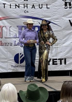 TMS FFA member Kambrie Koester receives her LBNFR prize belt buckle from the Little Britches Rodeo Princess. Photo provided.
