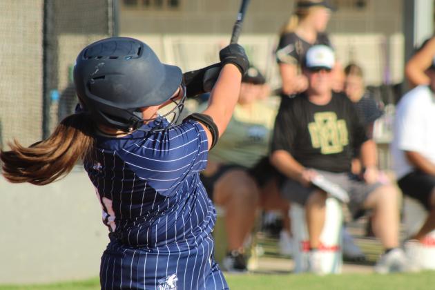 Shawnee's Brynlee Blomquist delivers a double during the second inning of the Aug. 20 home game against McAlester.
