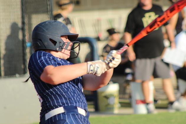 Shawnee's Caydance Herron takes a swing before walking during the second inning of the Aug. 20 home game against McAlester.