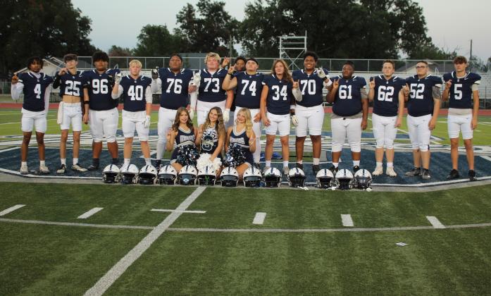 Shawnee High School held their "Meet the Players Night and Media Day" on Aug. 15. The football team has 14 seniors this year, and there are three senior cheerleaders. Shown, standing from left, are Rah'Mel Slaughter-Bey, Christian High, Kaeson Green, Nolan Ward, Chuffee Waldon, Logan Skelton, Corey McDowell, Aithon Lane, Jayce Bullock, Rosario Serena, Tyran Tinsley, Gage Schoneck, Robert Bell and Weston Setzer. The cheerleaders, seated from left, are Mary Beth King, Abigail Rogers and Abigail Clements.