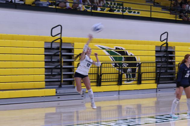 Shawnee's Libero, freshman Parker Lilley, serves during the Shawnee Volleyball Invitational match against Santa Fe South at OBU on Sept. 18.