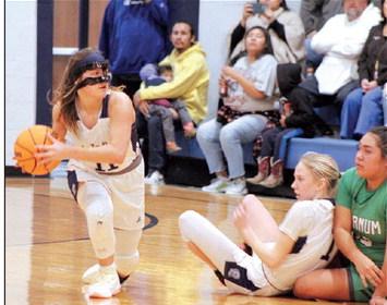 Asher’s Cadence Leba recovers the ball and looks to pass in the home game with Varnum on Jan. 2. Countywide &amp; Sun/Natasha Dunagan