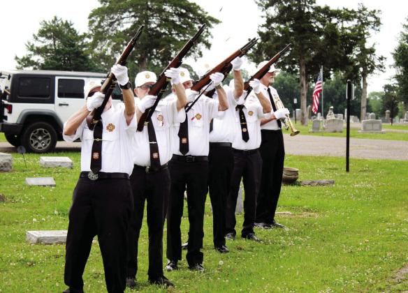 The Veterans of Foreign Wars Post 1317 Honor Guard gives a 21-gun salute before “Taps” is played during the Memorial Day service at Fairview Cemetery in Shawnee on May 29. Those with rifles are Don Plummly, Chris Hickmen, John Ferrell, Joe Gannon and Larry Johnson. John King is the bugler.