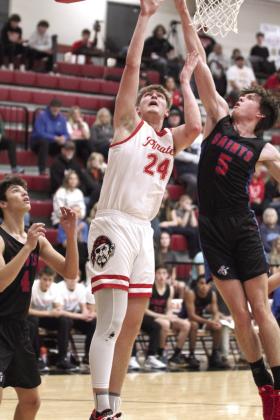 Dale senior Trayden Chambers sinks his shot at the end of the first quarter.