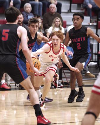 Dale’s Easton Edmonson guards the ball from the Oklahoma Christian School defense.