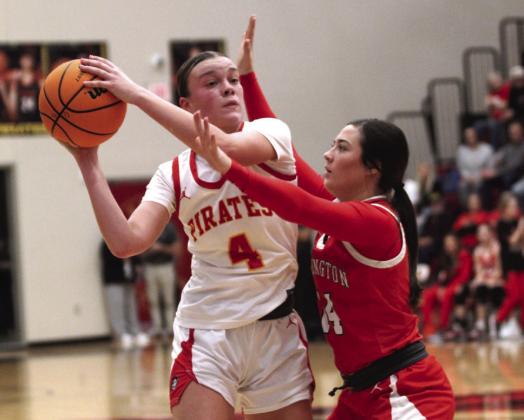 Dale senior Ava Bell guards the ball and looks to pass in the fourth quarter of the Boomarang Classic girls championship against Washington on Dec. 14. Over the three-day tourney in Dale, the Lady Pirates crashed Cushing, 8625; edged out Elgin, 73-37; but fell in a hard-fought game to Washington, 67-71, to place second in the tournament.