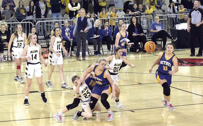 Parker Stevenson passes the ball to Hannah Davidson while Lilly Megehee blocks an Alva opponent. Countywide &amp;amp; Sun/Julie Talton