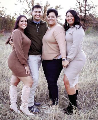 Shawnee Martinez poses with her three children, Khia (Colungo) Meeks and Antonio Colungo to the left and Taylor Kinley on the right.