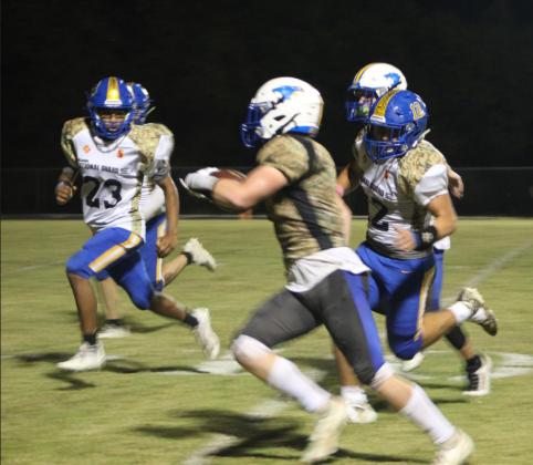 Bethel junior John Allred sprints with the ball as two Holdenville players look to tackle him during the district home game on Military Night, Oct. 14. Bethel won 67-13. Countywide &amp;amp; Sun/Natasha Dunagan