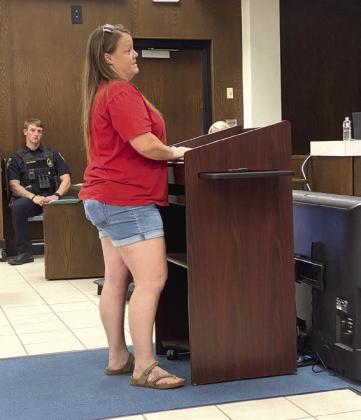 Cyndi Berger spoke during public comments, ending with, "I don't need social services crammed down my throat every time I turn around." She also spoke against a rezoning request.