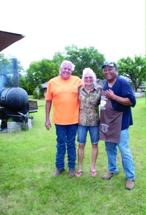 Ronnie and Joy Deatherage, with Carter's Beef in Tecumseh, pose with Frank Phillips of Brooksville. Carter's Beef donated 100 pounds of hamburger for the fundraiser, held at the Brooksville Community Center on June 20. J. Deatherage said the Brooksville community bought a quarter side of beef worth $1,134 for a drawing to raise money for the Brooksville Cemetery pavilion and restroom. Michael Watters won the drawing, and the event raised about $3,000. Photo courtesy of Ashaley Crawford
