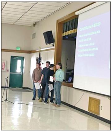 The SRC boys, pictured from left, Aaron Gay 7th grade, Trent Buchanan 8th grade, Spencer Kersey 7th grade, Kolton Yeager 8th grade present to the board.