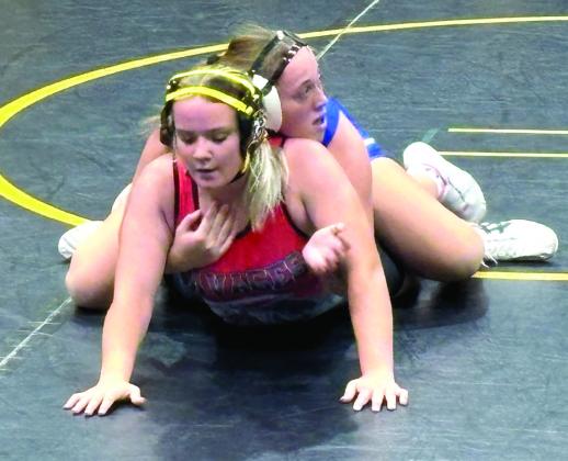 Tecumseh's Embrie Smith (bottom) tries to break out of Bailey Murray's hold at Tecumseh's home dual against Bethel on Red Ryder Night, Dec. 4. Smith won this match. The Lady Savages won their dual 54-6.