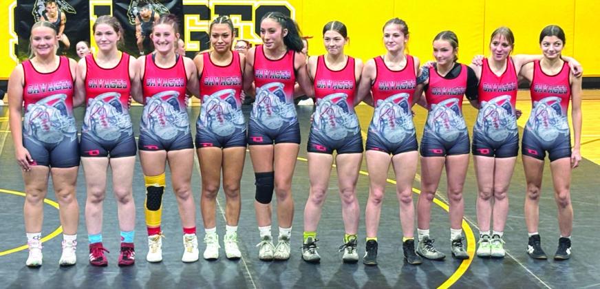 Tecumseh's wrestlers sport new special Red Ryder uniforms in memory of Ryder Kinsey during the home dual against Bethel on Dec. 4. According to Wrestling Booster Club President Courtney Schovanec, the Ryder's Shoes organization received a $600 contribution from TPS teachers, administrators and staff, made in the late Coach Quintin Beck's name. Another $380 was raised through a silent auction, hosted by the WBC, in which 50 percent went to Ryder's Shoes. See full cutline below.