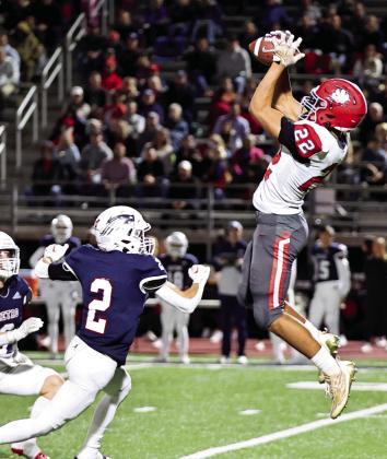 North Rock Creeks Caleb Hawkins leaps above the competition to make the catch for a first down. Photo courtesy of Gowin Photography