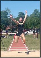 Pictured right, Tecumseh High Schools Kenzli Warden makes THS record breaking leap of 18’2” and will now compete at State. Photo provided