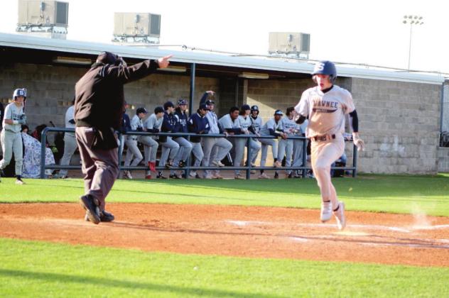 Shawnee sophomore Daxtyn Clark runs home after a teammate hit a single in the home game against Bishop McGuinness on April 7.
