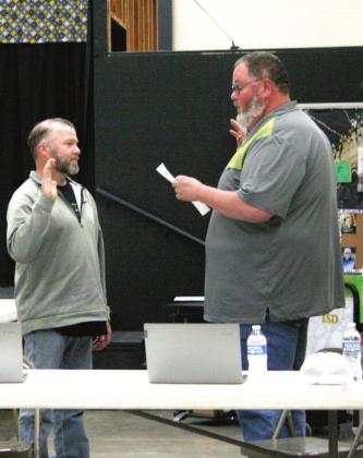 Tim Underwood swears Shawn Fleming into Office #2, for his third full term on the Tecumseh Board of Education. Fleming ran unopposed. Additionally, the Tecumseh Board of Education voted to not reorganize the board, at the April 11 meeting, and kept the officers the same as the previous year. Fleming remains as board president, Todd Kennedy is vice president, and Tim Underwood is clerk. Countywide &amp;amp; Sun/ Kendra Johnson