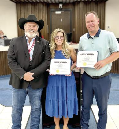 Shawnee Mayor Eric Stephens poses with re-elected commissioners, Lauren Richter (Ward One) and Daniel Matthews (Ward Six) after their swearing in at the July 20 City Council Meeting. Photo Provided