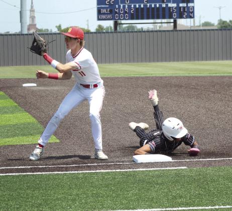 Dale junior Chase Harris waits for the catch, as a Kansas runner dives back to first, in the fourth inning of the Class 2A1 State Baseball Quarterfinal game, held at Shawnee High School on May 14.