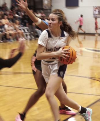 Asher's Makenah Templeton drives to the basket and gets a foul during the Nov. 7 home game against Paden.