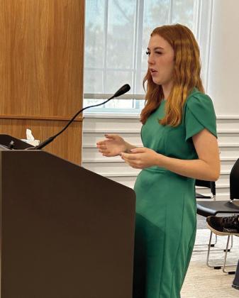 Kimberly Holland speaks to the commission about 4-H Hall of Fame photos. Photo by Suzie Campbell, Countywide &amp;amp; Sun