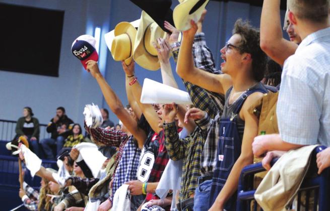 “Cowboys” in the Shawnee Student Section tip their hats and sing “Na Na Na, Hey Hey, Goodbye” (by Steam) to the Tecumseh boys team, after Shawnee won a hard-fought game, 63-58, on Jan. 14. Countywide &amp;amp; Sun/Natasha Dunagan