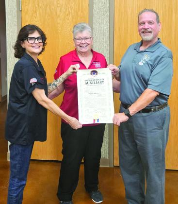 American Legion State Auxiliary 1st Vice President Donna Snodgrass, center, presents an Auxiliary Charter to Madill Auxiliary President Melissa Green, left, and Post 99 Commander Doug Crowson recently. Snodgrass has been working on establishing new Auxiliaries for posts that lack them. She has also started one in Tulsa. Photo provided