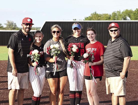 Coach Ray &amp; Coach Cox celebrate with the seniors, Laynee Joyner, Jaxtyn Ratcliff, Sophie Morris and Emma Degman after the double win against Lexington on April 13. Photo Courtesy of Gowin Photography