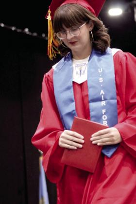 Sophie Hawkins descends from the stage after receiving her diploma and U.S. Air Force stole during the graduation. Natasha Dunagan, Countywide &amp;amp; Sun