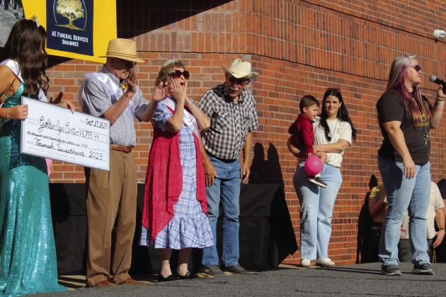 Senior Sweetheart Almeda Dyer gasps and Tecumseh Frontiersman Lonnie Hurst, left, claps as 2024 Miss Frontier Days Jalee Meyers presents a check for $1,755.44 to the Golden Age Center before the Frontier Days Parade on Sept. 27. Also shown are Jack Parson, President of the GAC Site Council, Pageant Director Katie McMahan and Tecumseh Chamber of Commerce Executive Director Kimberly Elliott, far right. Natasha Dunagan, Countywide &amp;amp; Sun