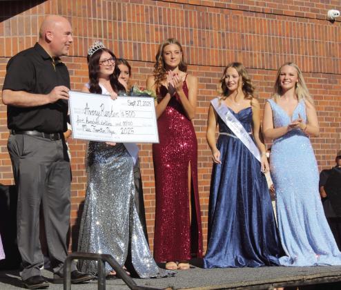 Tecumseh Public Schools Superintendent Robert Kinsey presents a $500 scholarship check to Avery Renken who was crowned Miss Frontier Days before the Frontier Days Parade on Sept. 27. Miss Frontier Days Runner Up was Addison Taron, second from right. TPS is a sponsor of the Frontier Days Pageant, which was held on Sept. 21. Natasha Dunagan, Countywide &amp;amp; Sun
