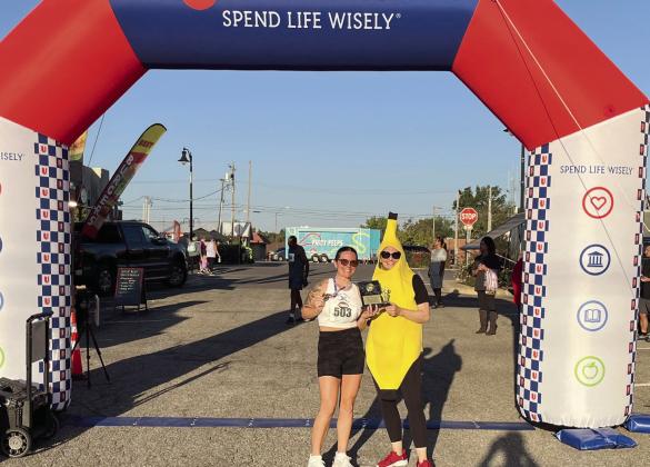 First United Bank of Tecumseh were out early to greet runners as they got ready to take to the streets of Tecumseh in the annual Justin Terney 5K. Pictured above, Community Bank President, SVP, Jill Spencer, presents an award to first place woman, Lexi Christensen. Photo provided