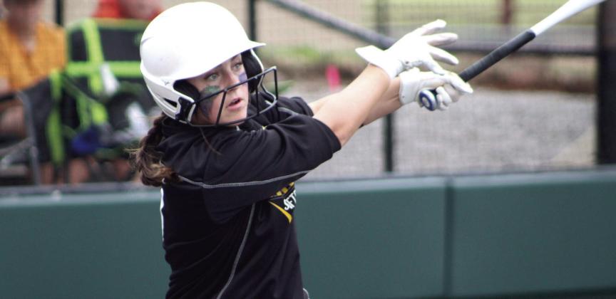 Tecumseh senior Taylor Gage watches the ball after a hit in the Chandler regional game on April 28 at FireLake Ball Fields. The Lady Savages won that game, 13-2, and with Newcastle, 16-4, to become Class 5A Regional Slow Pitch Softball Champions. Countywide &amp; Sun/Natasha Dunagan