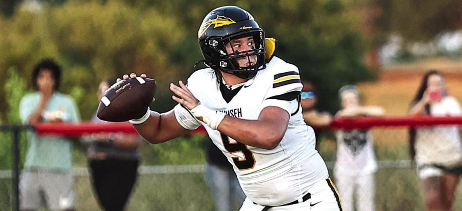 Tecumseh's Cooper Laughlin looks down field for a receiver in the loss against North Rock Creek on Aug. 28. Photos courtesy of Gowin Photography